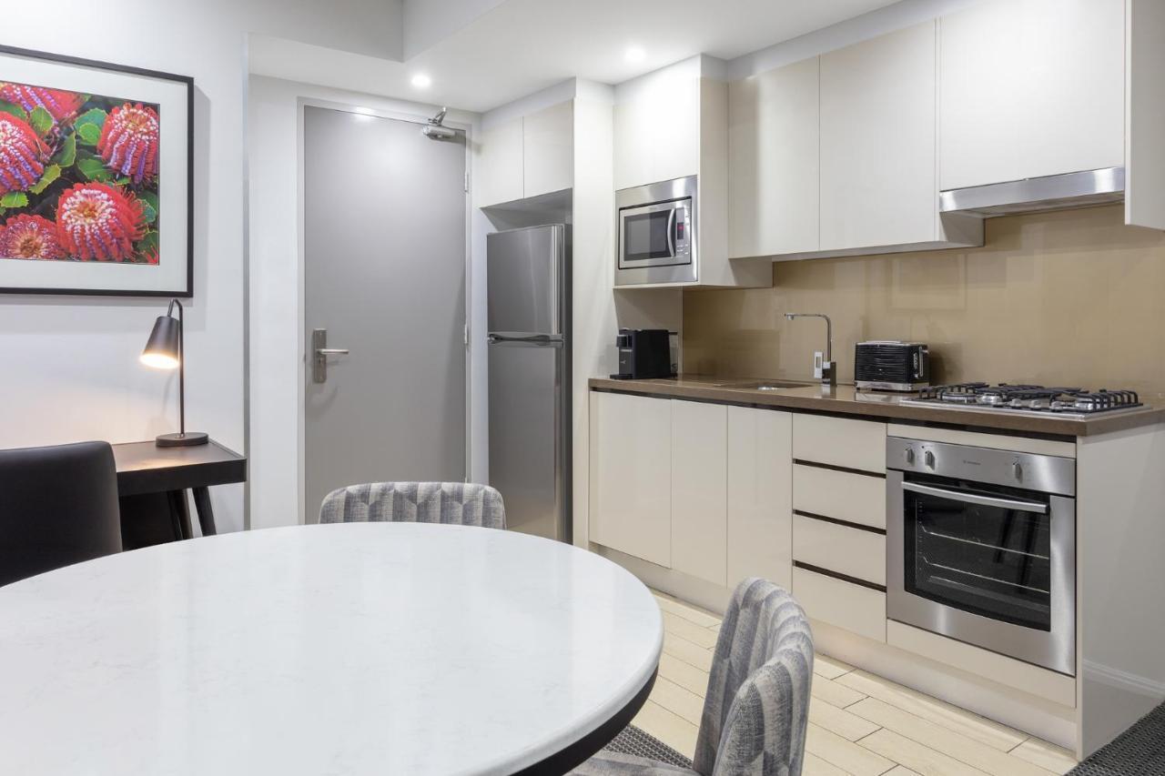 Meriton Suites North Ryde Sydney Exteriör bild A typical kitchen in a serviced apartment