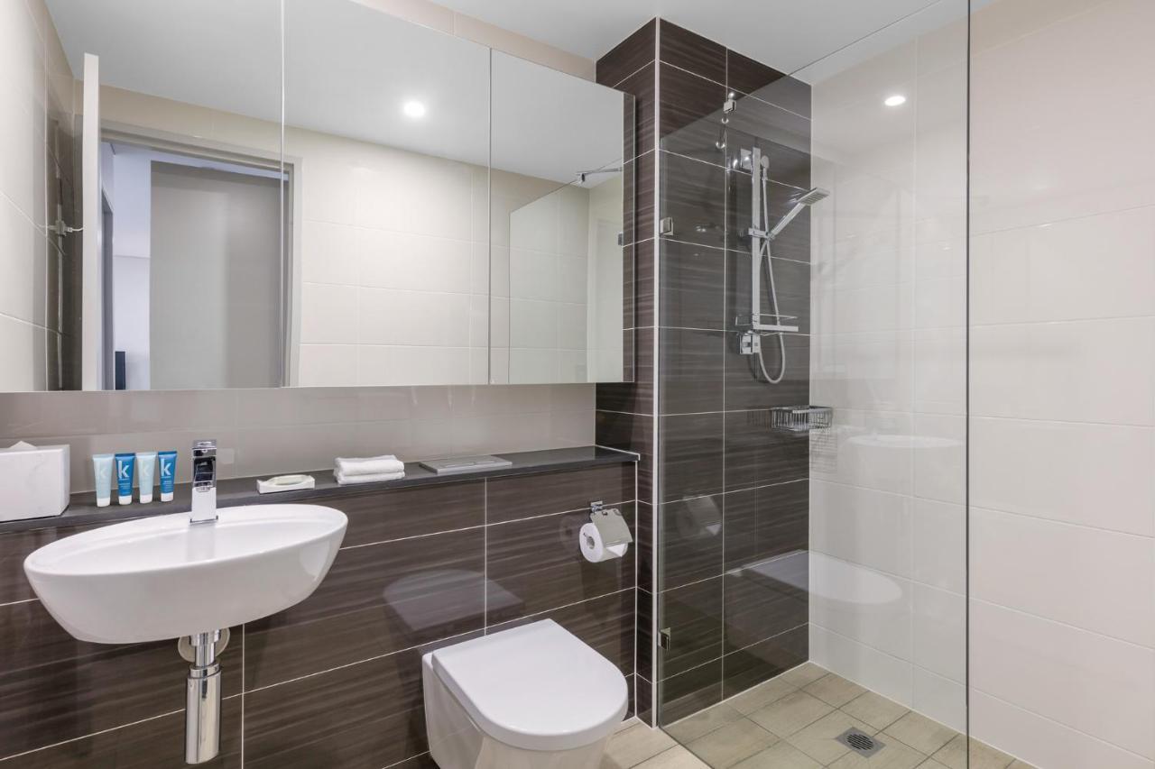 Meriton Suites North Ryde Sydney Exteriör bild A modern bathroom with a shower cubicle