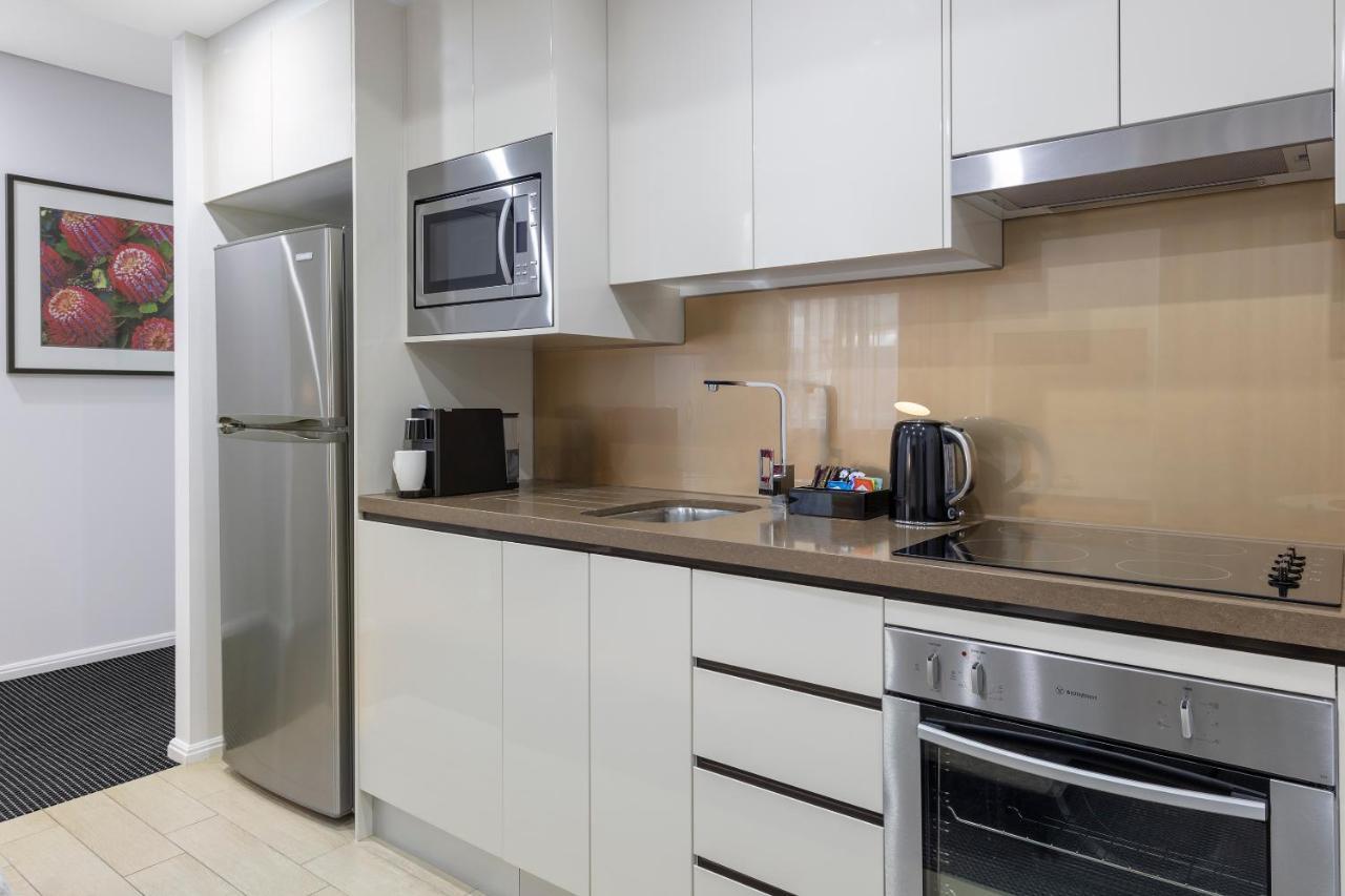 Meriton Suites North Ryde Sydney Exteriör bild A typical kitchen in a serviced apartment