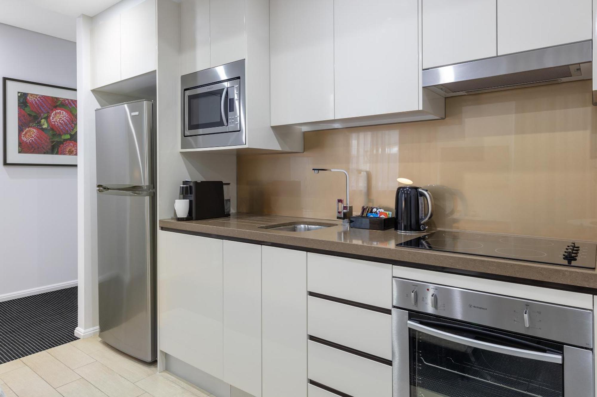 Meriton Suites North Ryde Sydney Exteriör bild A typical kitchen in a serviced apartment